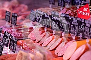 Sumy, Ukraine - December 21, 2023: Meat products store. Sausages on display at a grocery store