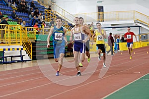 SUMY, UKRAINE - FEBRUARY 17, 2017: sportsmen running qualification race in the men`s 400m running in an indoor track and