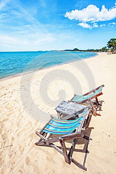 Sun beach chair on shore near sea