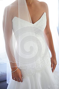 Sun beams around a stunning bride in a beautiful elegant white w