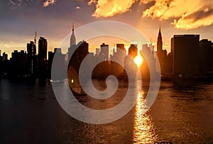 Sun beams through the skycraper buildings in New York City photo