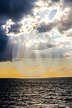 Sun beams through stormy clouds