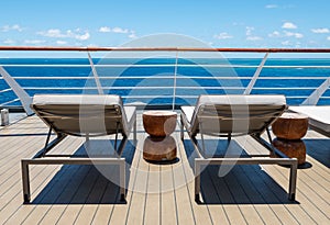 Sun beds on deck of cruise ship.