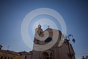 Sun behind the bell tower.