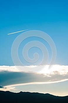 Sun behind clouds on sunset