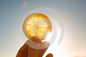 Sun behind lemon slice