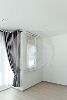 Sun-blocking blinds are hung on the windows