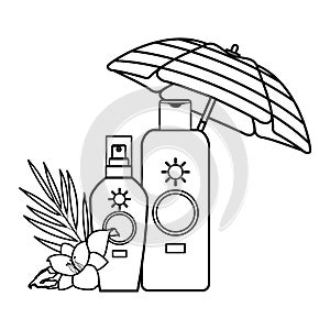 Sun bronzer bottles with flower under beach umbrella in black and white