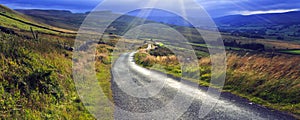 Sun bursting through cloud above Crag Side Road Yorkshire Dales