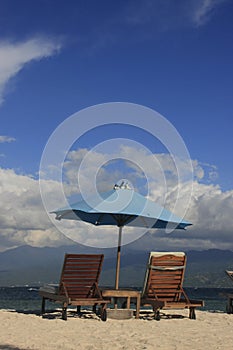 Sun chairs and umbrella on a beach