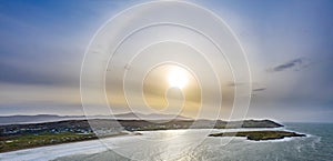 Sun with circular halo occurring due to ice crystals in atmosphere - Portnoo, County Donegal - Ireland