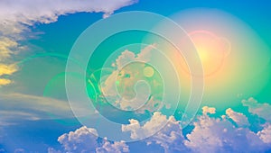 Sun and clouds with lens flare