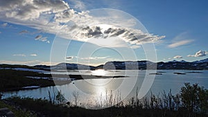 Sun in Clouds over Lake Tornetrask in Abisko National Park in Sweden