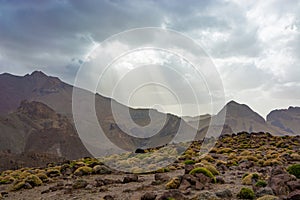 Sun and clouds over mountain ridge