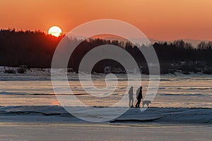 Sun and couple on a walk