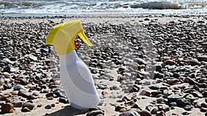 Sun cream bottle on the beach. Sun protection cream, uv rays