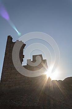 Sun crossing castle ruins