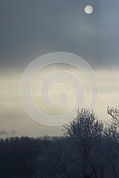 The sun through the dark sky