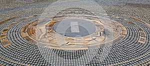 Sun-dial and astronomical clock made of copper reliefs which illustrates naked women in pavement in Karlovy Vary