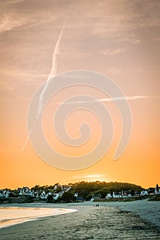 Sun disappearing over Audiernes beach in France