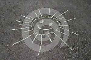 Sun drawing on asphalt