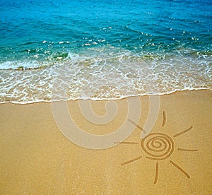 Sun drawing on a beach