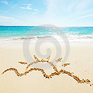 Sun drawing on a beach