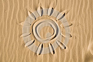 Sun drawn in the sand