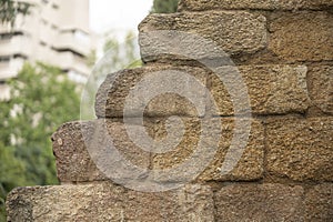 Sun drenched stone wall background