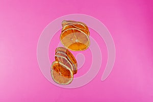 Sun-dried dried lemon close up on colored background