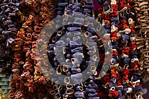 Sun dried eggplants and peppers strings hanging on spice bazaar