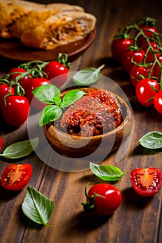 Sun dried and pickled tomatoes with fresh herbs and spices