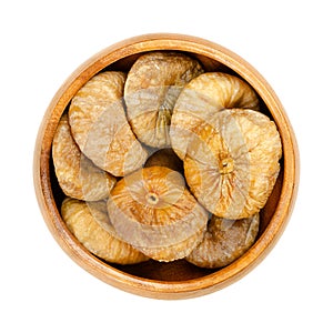 Sun dried, ripe and whole common figs, Ficus carica, in wooden bowl