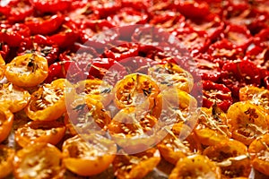 Sun dried tomatoes, dried red and yellow cherry tomatoes, close up,