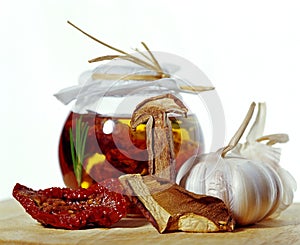 Sun dried tomatoes in jar with garlic