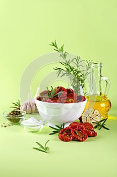 Sun-dried tomatoes, olive oil, garlic, salt, dried basil and fresh rosemary