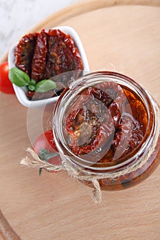 Sun dried tomatoes with olive oil in a jar