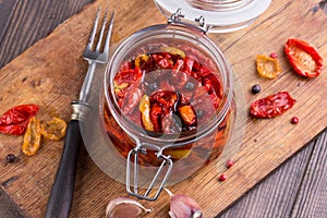 Sun dried tomatoes with olive oil in a jar