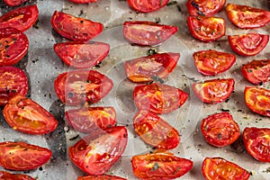 Sun dried tomatoes on white baking paper