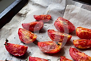 Sun dried tomatoes on white baking paper