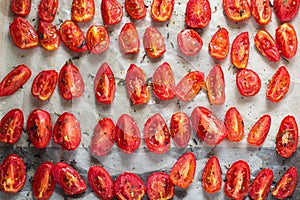 Sun dried tomatoes on white baking paper