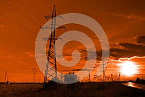 Sun and electricity - powerlines towers at sunset