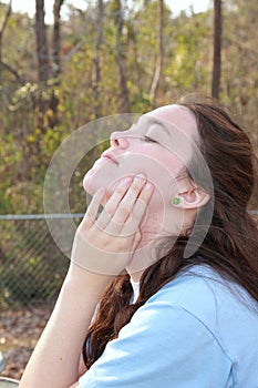 Sun on face teen girl