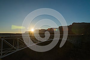 Sun flare brust on the Navajo bridge in Sunset view