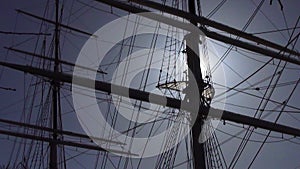 Sun flare through sailing ship masts