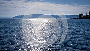 Sun glare on the water of lake Baikal