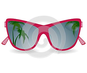 Sun glasses with reflexion of palm trees photo