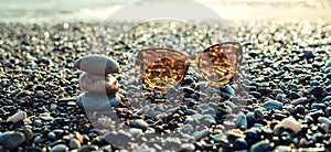 Sun glasses on a sea coast.