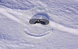 Sun glasses on snow