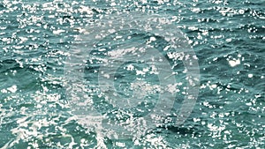 Sun glitter on sea surface. Water surface background.